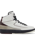 Side of the Nike Air Jordan 2 Retro A Ma Maniere sneakers in white and burgundy