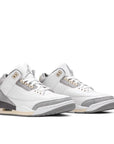 A pair of Nike Jordan Air 3 A Ma Maniere basketball shoes in a white grey and subtle cream colour