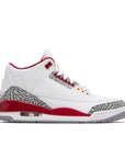 Side of Nike Jordan Air 3 basketball shoes in a white and cardinal red colour with an elephant print
