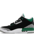 Side of Nike Jordan Air 3 basketball shoes in a black and pine green colour with an elephant print