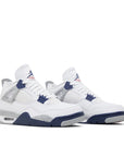 A pair of Nike Air Jordan 4 Midnight Navy basketball sneakers