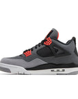 Side of Nike Air Jordan 4 retro infared basketball shoes in a white, black and grey colourway.