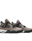 A pair of Nike Air Jordan 4 Retro Taupe Haze basketball sneakers in taupe