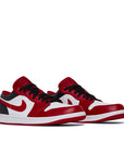 A pair of Nike Air Jordan 1 Low Bulls sneakers in white, red and black