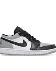 Side of Nike Air Jordan 1 Low Shadow Toe sneakers in grey and black