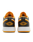 Heels of the grade school Nike Air Jordan 1 Low Taxi children shoes in black, yellow and white