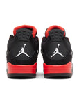 Heels of the grade school kids Nike Air Jordan 4 red thunder basketball shoes in black and red