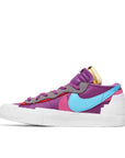 Side of the Nike Blazer Low Sacai KAWS Purple Dusk skateboard shoe in purple and white