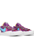A pair of Nike Blazer Low Sacai KAWS Purple Dusk skateboard shoe in purple and white