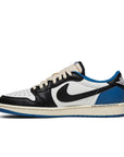 Side of the Nike Dunk Low Fragment x Travis Scott exclusive sneakers in white. black and blue