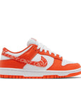 Side of the womens Nike dunk low in a white orange "orange paisley" colour