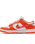Side of the womens Nike dunk low in a a white orange "orange paisley" colour