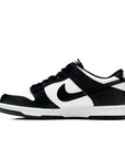 Side of the youth version of the Nike dunk low in a black white "Panda" colour