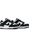A pair of the toddler version Nike dunk low in a black white "Panda" colour