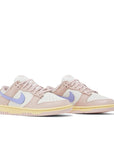 A pair of the womens Nike dunk lows in a pink lilac "pink oxford" colour
