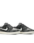 A pair of the Nike dunk low retro animal pack zebra inspired colour