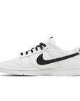 Side of the Nike Dunk Low Reverse Panda basketball shoes in white and black