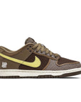 Side of the Nike dunk low sp undefeated canteen in brown and lemon