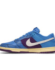 Side of the Nike dunk low undefeated 5 On It in a blue exotic colour