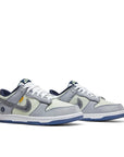 A pair of Nike Dunk Low Union Passport Pack Pistachio sneakers