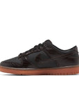 Side of the Nike Dunk Low Velvet Brown Black mens sneakers in brown