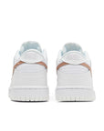Heel of the Nike dunk low grade school sneaker in white and pink