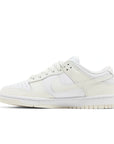 Side of the Nike Dunk Low Retro (W) Coconut Milk (DD1503-121) in Sail and Coconut Milk White.
