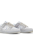 A pair of the Nike dunk low wolf grey pure platinum