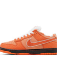 Side of Nike SB Dunk Low Concepts Orange Lobster in Orange.