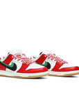 A pair of Nike sb dunk low Frame Skate skating shoes in a red, yellow, and green Habibi colour