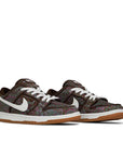 A pair of the Nike sb dunk low pro skating shoes in paisley brown