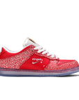 Side of the Nike sb dunk low stingwater magic mushroom skating shoes in red and white
