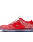 Side of the Nike sb dunk low stingwater magic mushroom skating shoes in red and white