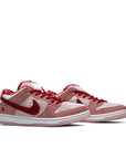 A pair of Nike sb dunk low StrangeLove Skateboard skating shoes in a pink colour