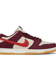 Side of the Nike sb dunk low pro skate like a girl skating shoes in burgundy and cream