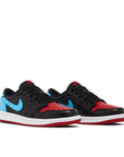Pair of Jordan 1 Retro Low OG NC to Chi in black, red and blue