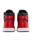Heels of Jordan 1 Retro High OG Satin Bred (W) in black and red