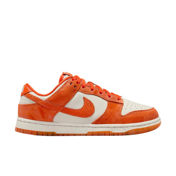 Side of Nike Dunk Low Cracked Orange (W) in orange and bone.