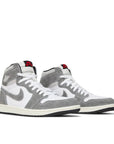 Pair of Jordan 1 Retro High OG Washed Black in white and grey.