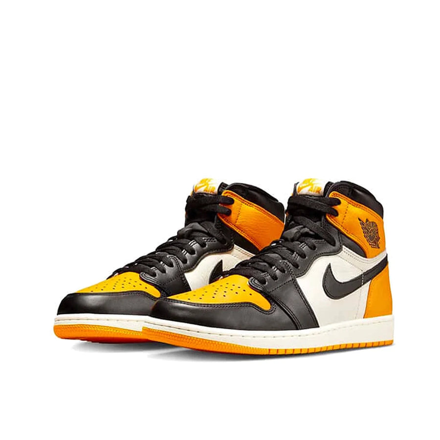 A pair of Nike Air Jordan 1 Retro High Yellow Toe Taxi basketball shoes in yellow, white and black