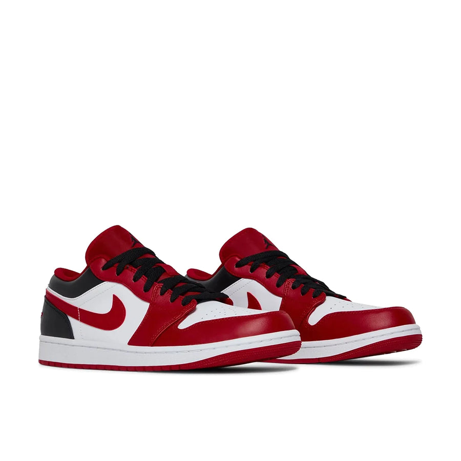A pair of Nike Air Jordan 1 Low Bulls sneakers in white, red and black
