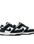 A pair of the toddler version Nike dunk low in a black white "Panda" colour