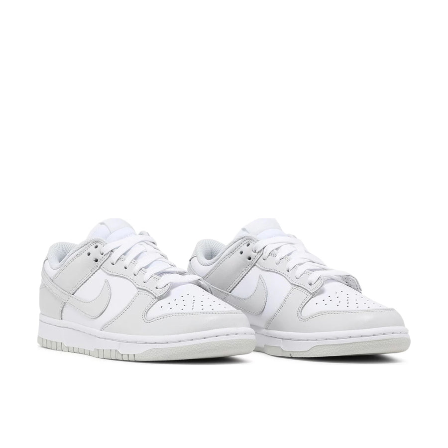 Pair of Nike Dunk Low photon dust in white and grey