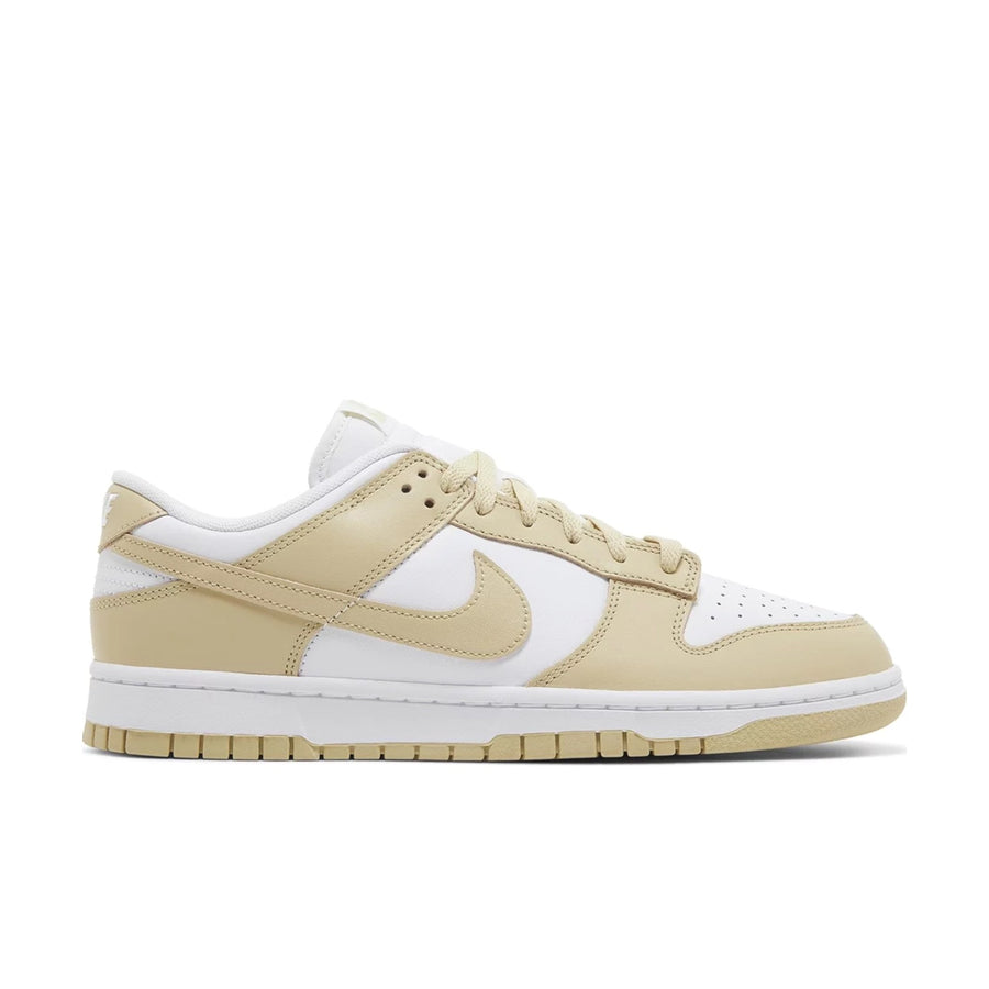 side of Nike Dunk Low team gold in white and gold