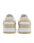 heels of Nike Dunk Low team gold in white and gold