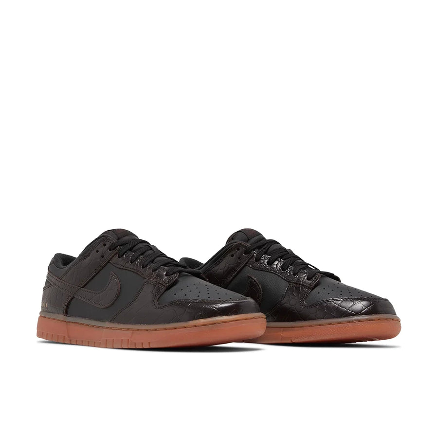 A pair of Nike Dunk Low Velvet Brown Black mens sneakers in brown