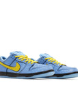Pair of Nike Dunk SB Low The Powerpuff Girls Bubbles in blue and yellow