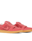 Pair of Nike SB Dunk Adobe in pink and red