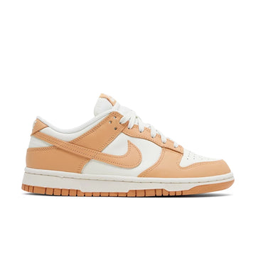 Side of Nike Dunk Low Harvest Moon (W) in white and light brown.