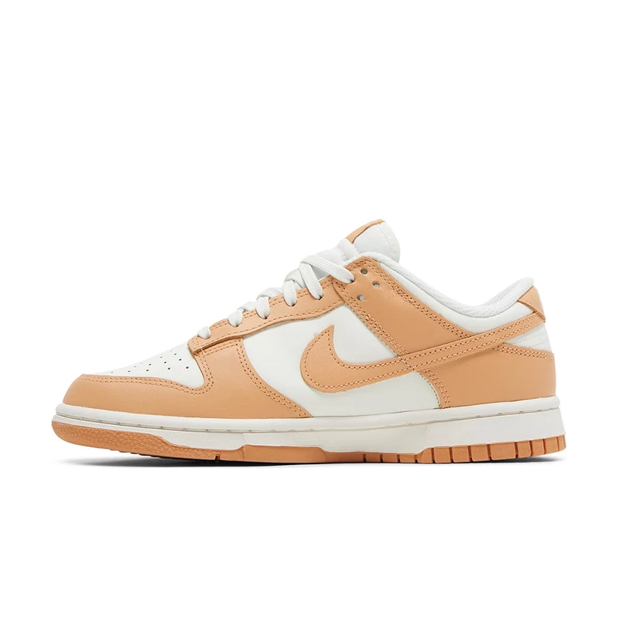 Side of Nike Dunk Low Harvest Moon (W) in white and light brown.